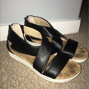 Black leather crisscross sandals
